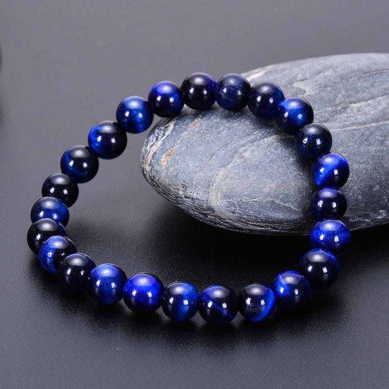 Detailed look at the surface patterns of the tiger eye stones, each bead uniquely textured, symbolizing inner strength and resilience.